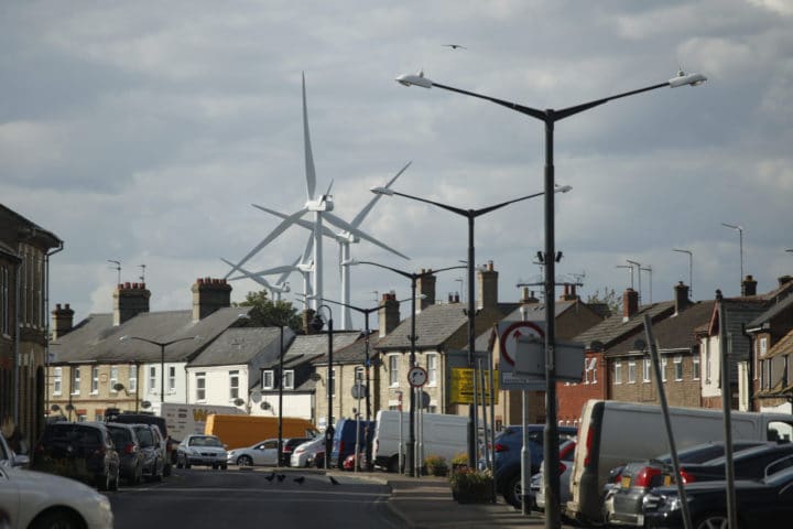 Wind turbines behind residential street