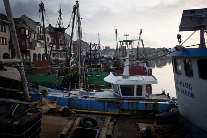 Fishing boats in the harbour at Maryport, cloudy sky
