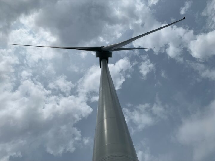 Wind turbine against a cloudy sky
