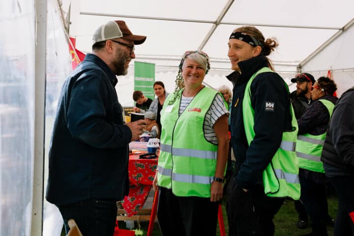 Three volunteers talking at Heart of Sidley festival