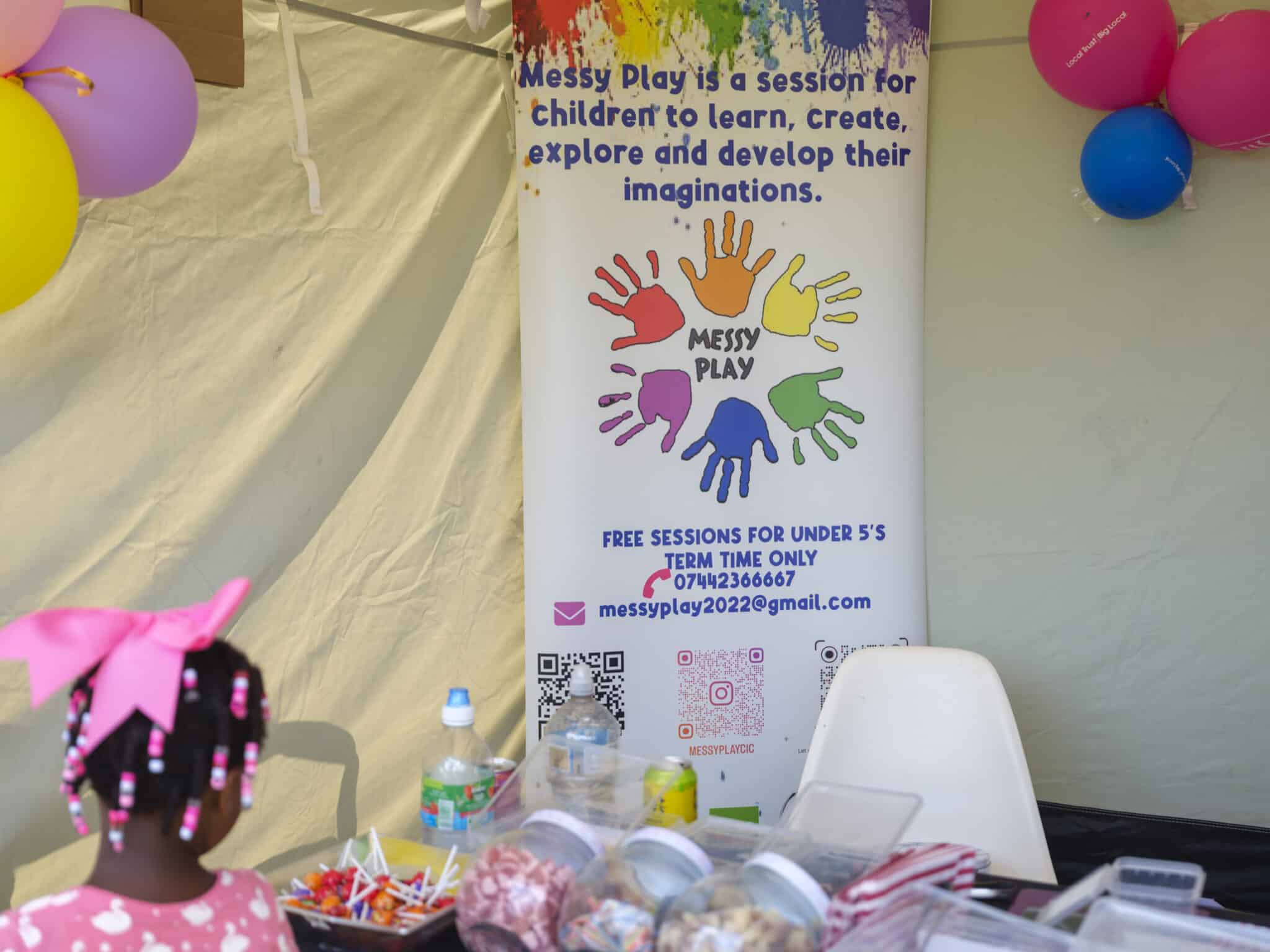 Messy Play banner and stall with sweets in jars