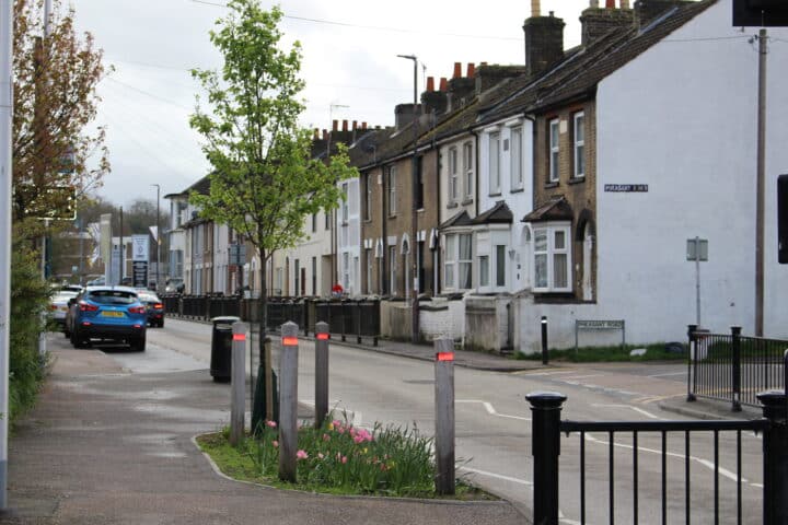 A street view of a row of houses