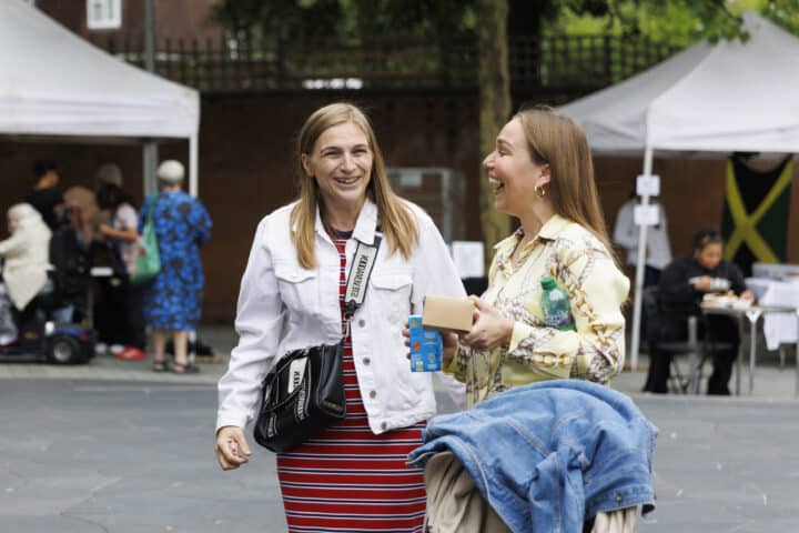 Two women chatting and laughing