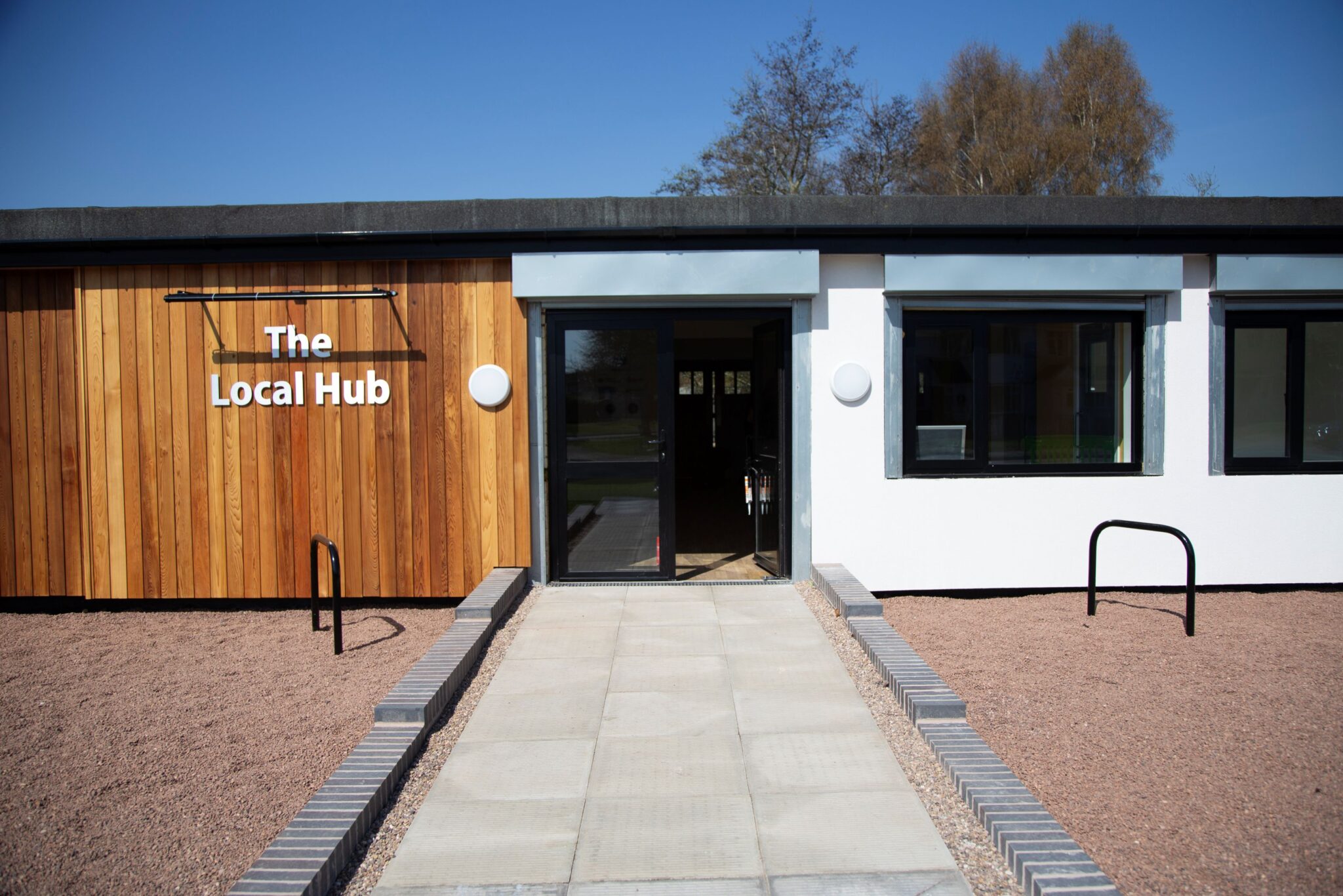 A community building with the inscription 'The Local Hub'