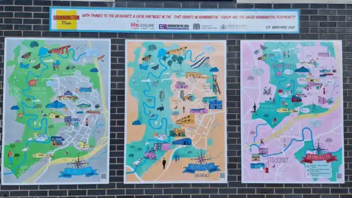 Three illustrated maps of Brinnington displayed on a brick wall. show local landmarks, wildlife, walking routes, and points of interest, including a historical map of the area. A banner above the maps reads 'With thanks to the residents and local partners in the That Counts in Brinnington forum and the wider Brinnington community', established November 2021.